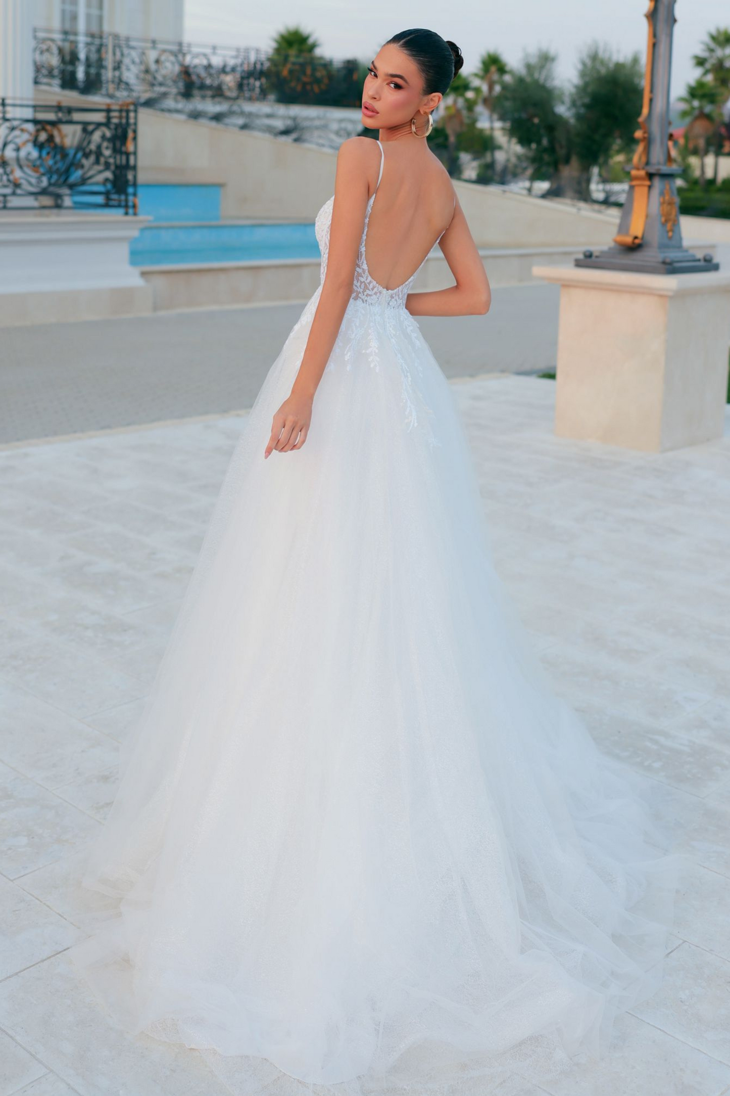 Tina Holly wedding dress with corseted lace bodice and attached overskirt with train in off white glitter tulle