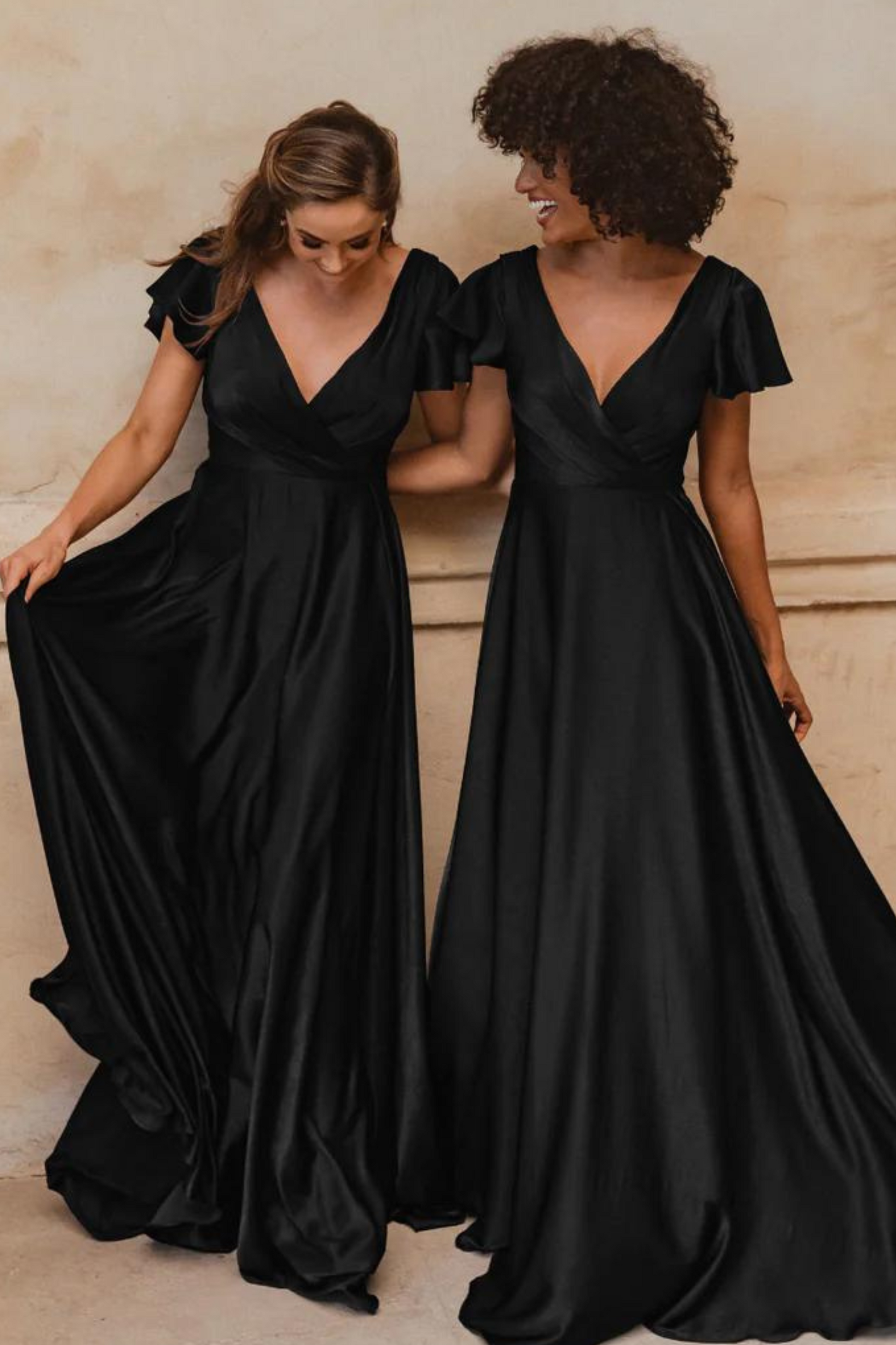 A-line black satin bridesmaids dress with V neckline and flutter sleeves