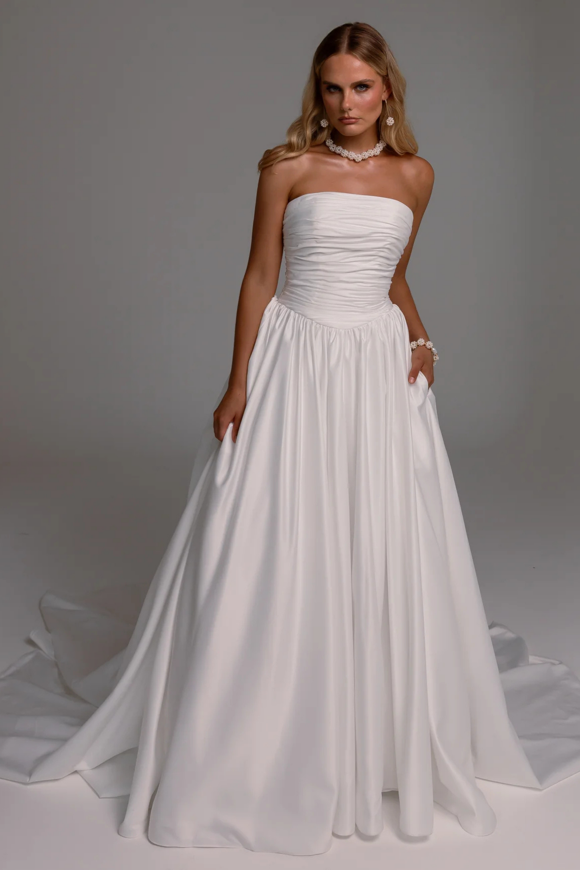 Woman wearing a strapless white wedding dress 