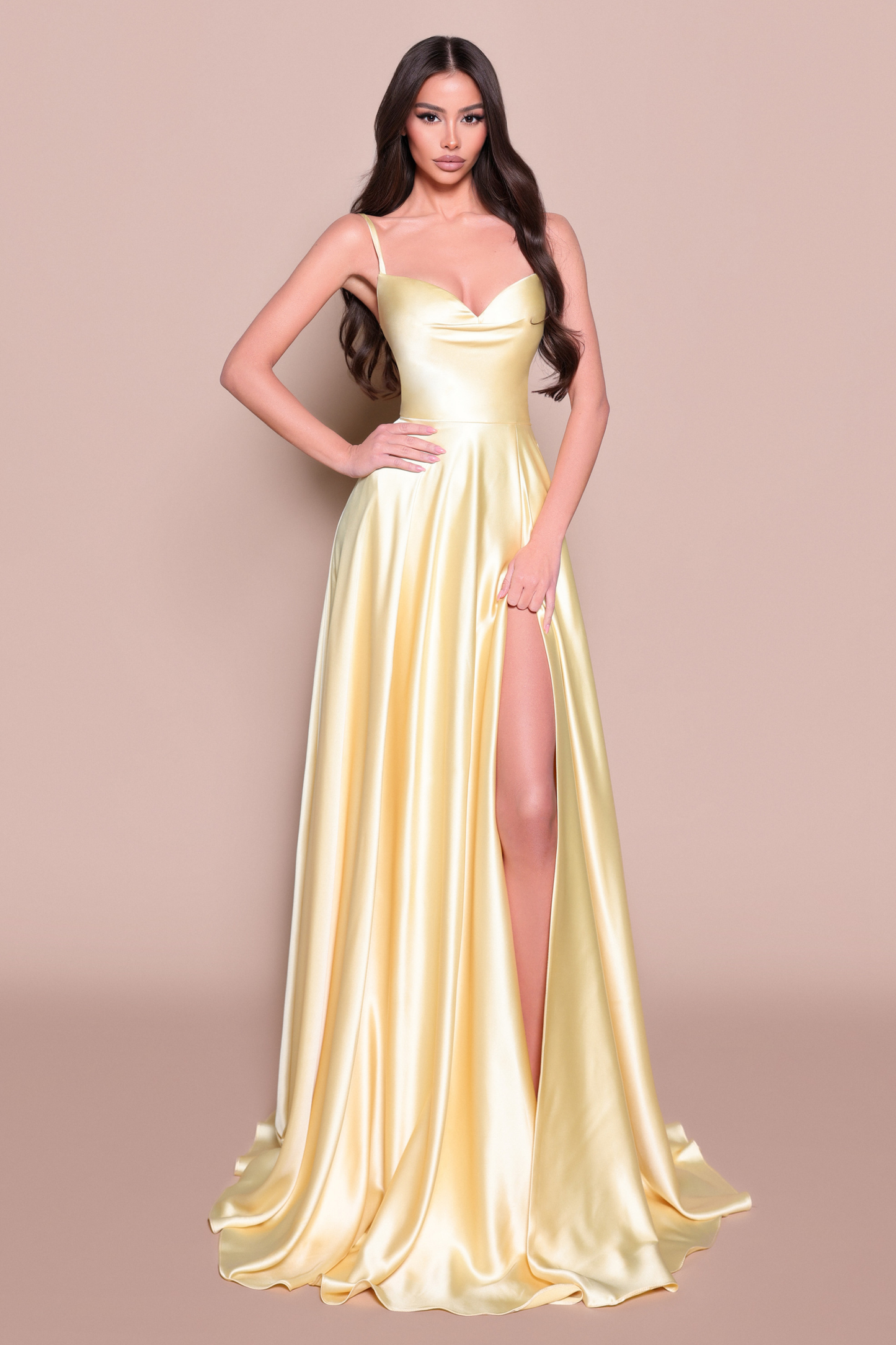 Woman wearing a lemon satin evening/bridesmaid gown 