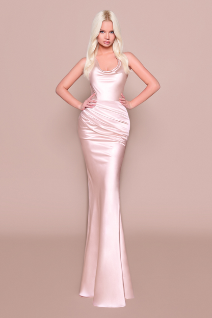 Woman wearing a long fitted, elegant pale pink dress 