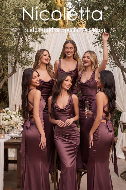 Group of women in Nicoletta bridesmaid dresses at an outdoor event.